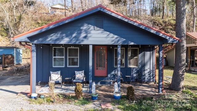 view of front of property with covered porch and board and batten siding