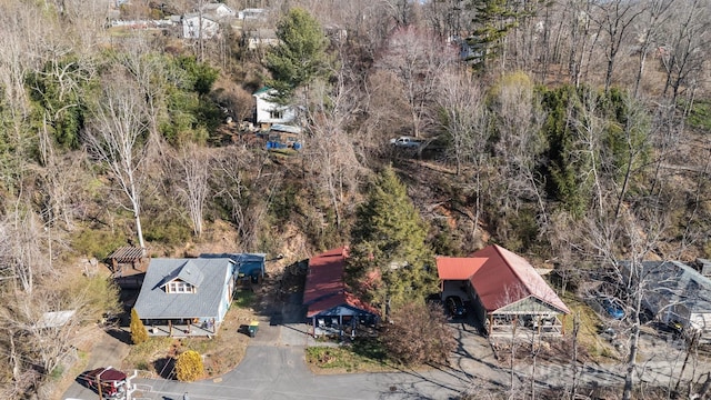 birds eye view of property with a wooded view