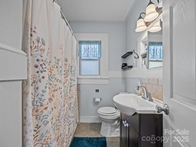 full bath featuring vanity, a shower with shower curtain, ornamental molding, tile patterned floors, and toilet