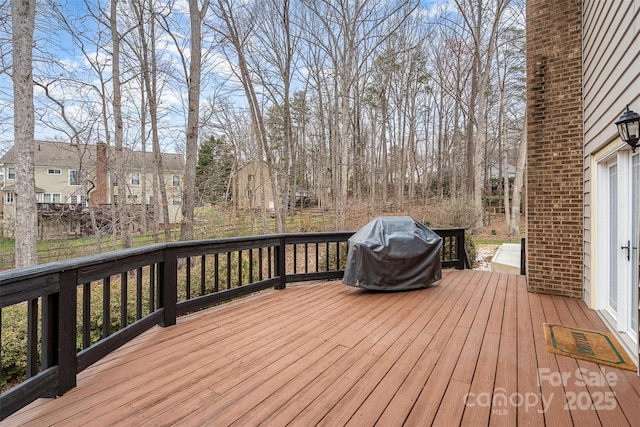 wooden terrace with area for grilling