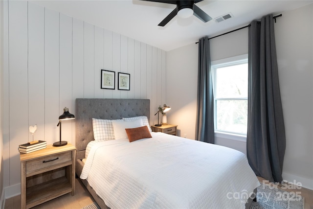 bedroom featuring visible vents and ceiling fan