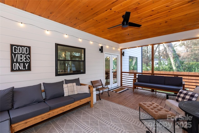 exterior space with an outdoor living space, french doors, and a ceiling fan