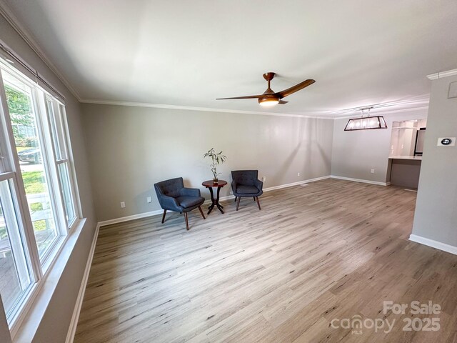 7812 Highbanks Ct, Charlotte, NC 28212 - sitting room featuring baseboards, wood finished floors, ceiling fan, and ornamental molding