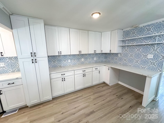 7812 Highbanks Ct, Charlotte, NC 28212 - kitchen with white cabinets, visible vents, open shelves, and light wood finished floors