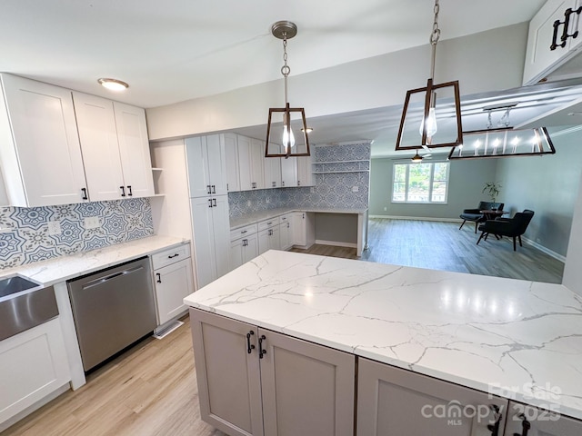 7812 Highbanks Ct, Charlotte, NC 28212 - kitchen with dishwasher, light stone countertops, decorative light fixtures, and open shelves