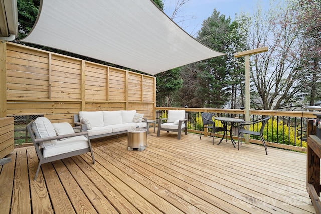 wooden deck featuring outdoor lounge area