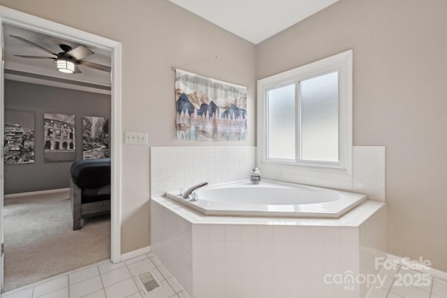 bathroom featuring baseboards, visible vents, ceiling fan, tile patterned flooring, and a garden tub