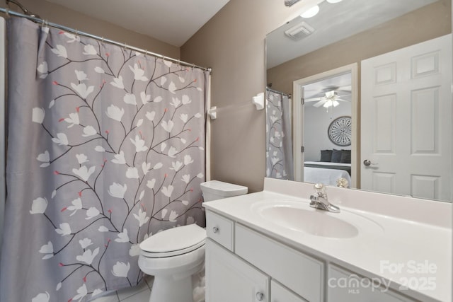 bathroom featuring visible vents, toilet, tile patterned floors, vanity, and a ceiling fan