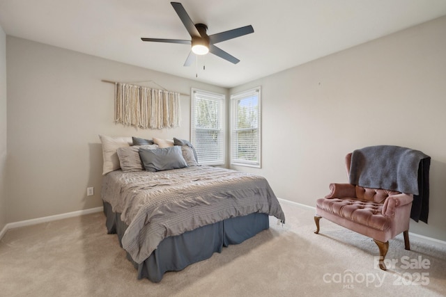 carpeted bedroom with a ceiling fan and baseboards