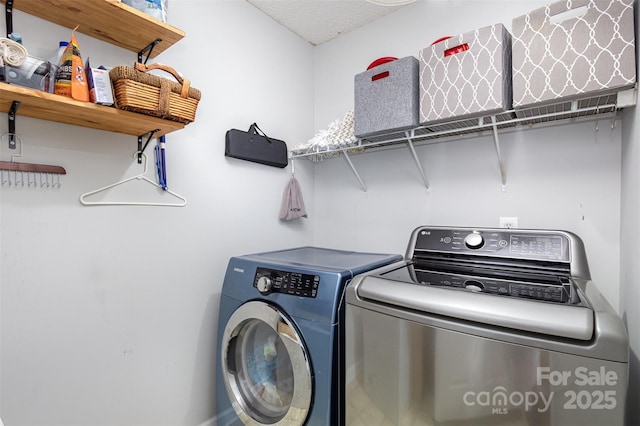 laundry area with laundry area and separate washer and dryer