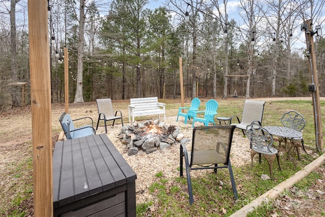 view of yard featuring a fire pit