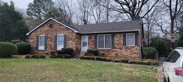 425 Whitethorn Dr, Gastonia, NC 28054 - view of front of home with brick siding, a front yard, and a shingled roof
