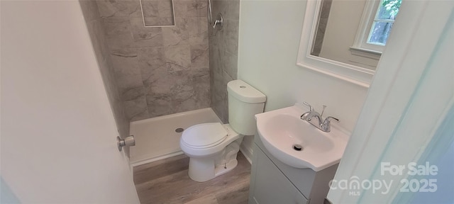 425 Whitethorn Dr, Gastonia, NC 28054 - full bathroom featuring vanity, wood finished floors, and a tile shower