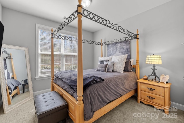 carpeted bedroom with multiple windows and baseboards