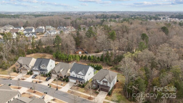 bird's eye view with a view of trees and a residential view