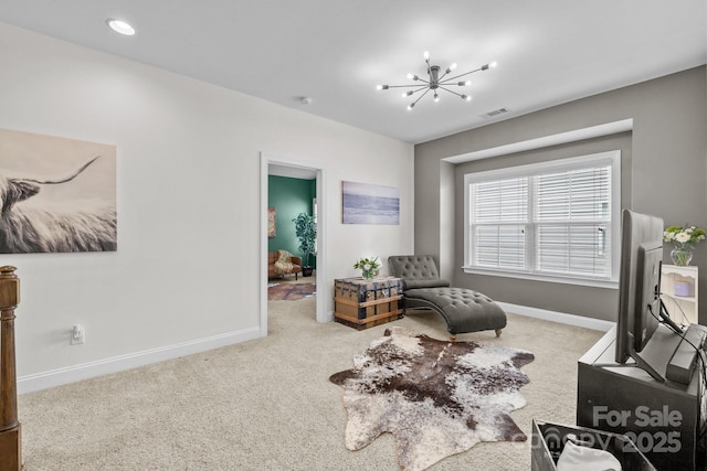 sitting room featuring visible vents, an inviting chandelier, baseboards, and carpet