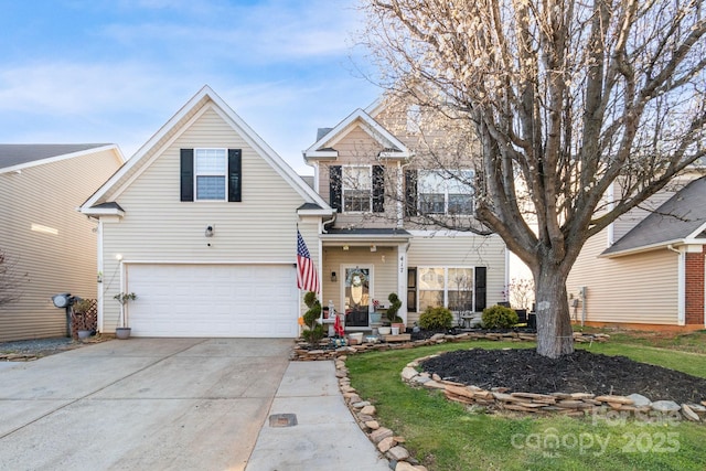 traditional home featuring concrete driveway and a garage