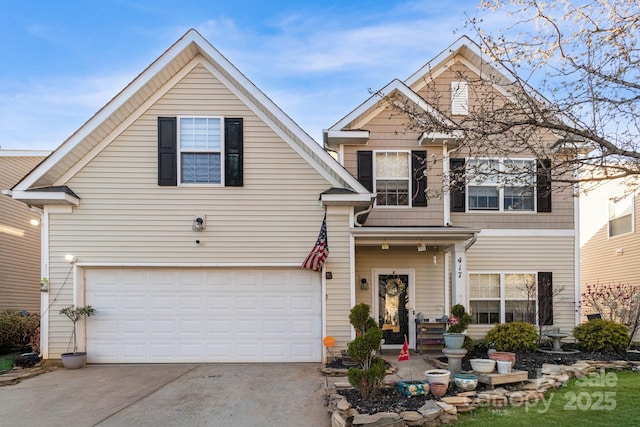 traditional-style home with an attached garage and concrete driveway