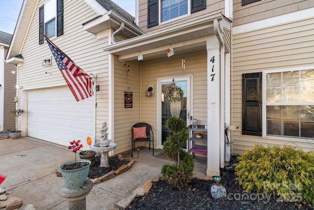 entrance to property with a garage and driveway