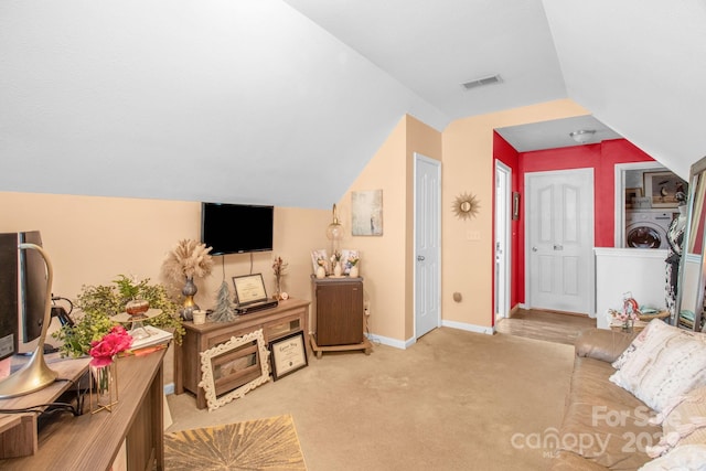 carpeted living area with visible vents, baseboards, and lofted ceiling