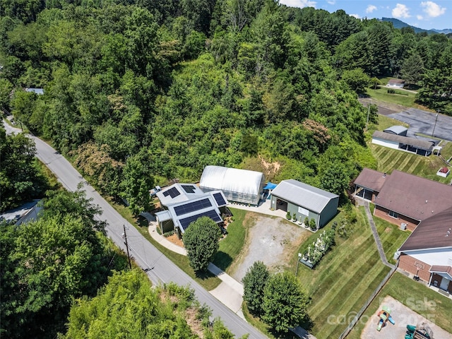 bird's eye view featuring a forest view