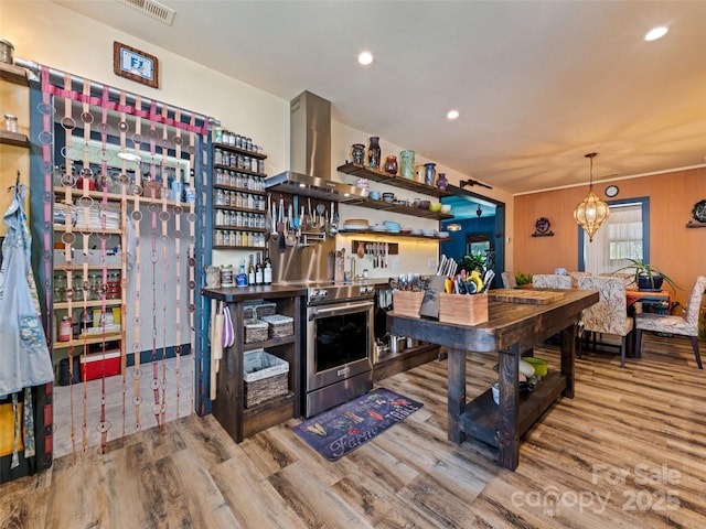 interior space featuring recessed lighting, visible vents, an inviting chandelier, and wood finished floors