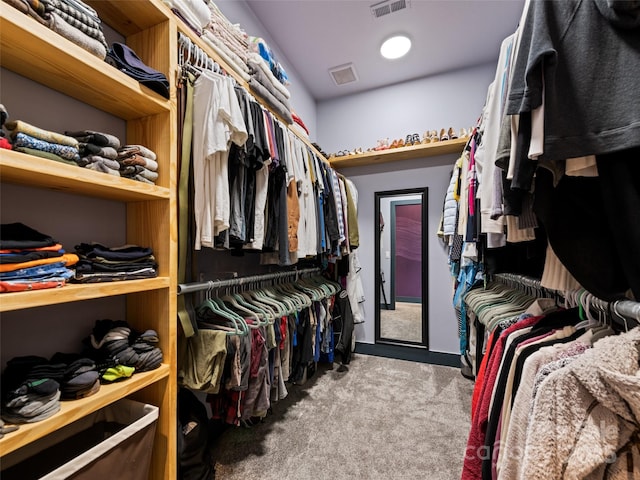 walk in closet featuring carpet flooring and visible vents