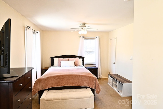 bedroom with ceiling fan and carpet floors