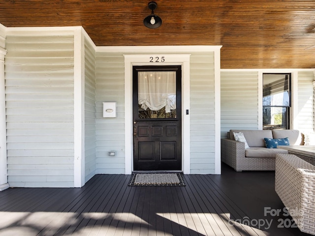 doorway to property featuring a porch