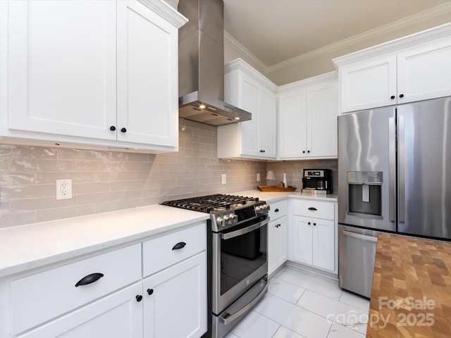 kitchen featuring ornamental molding, backsplash, appliances with stainless steel finishes, wall chimney exhaust hood, and light countertops