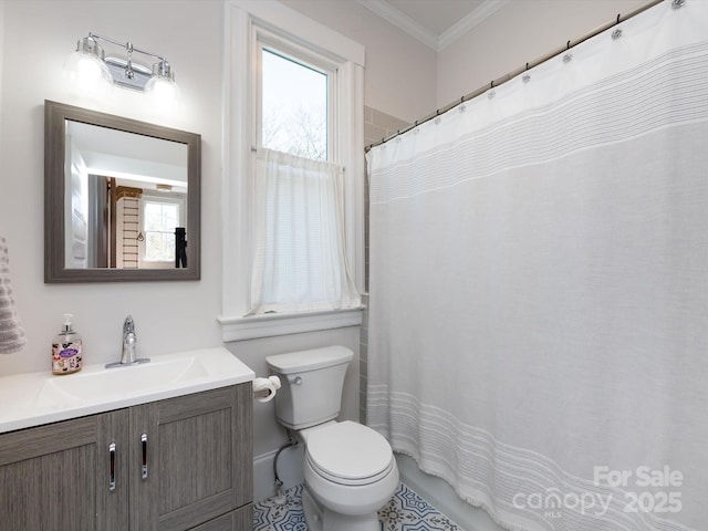 full bathroom with toilet, vanity, a shower with curtain, and ornamental molding