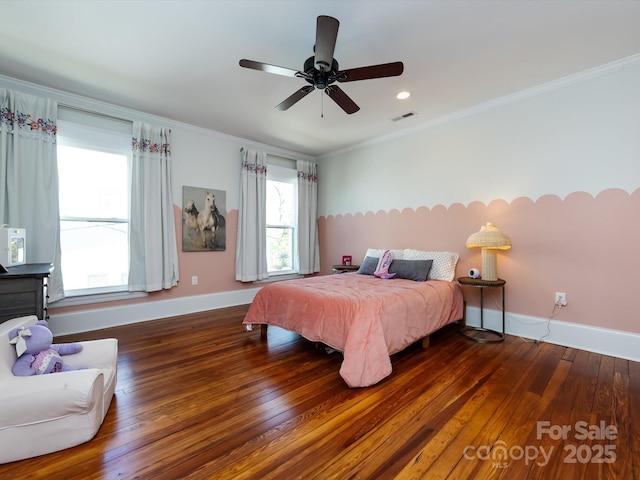 bedroom with visible vents, a ceiling fan, hardwood / wood-style flooring, crown molding, and baseboards