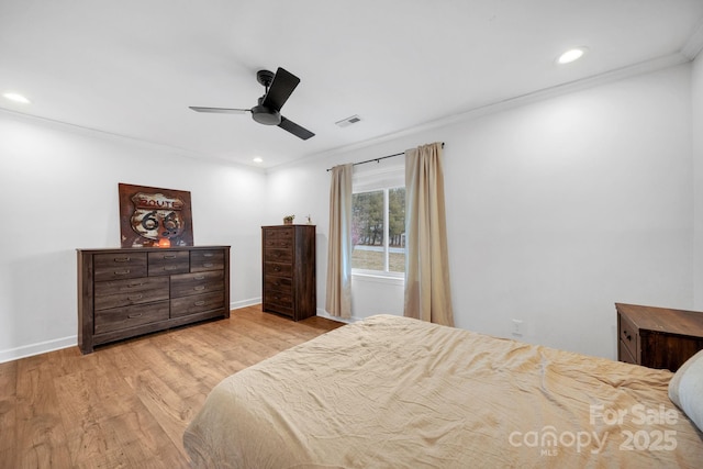 bedroom featuring wood finished floors, baseboards, visible vents, recessed lighting, and ornamental molding