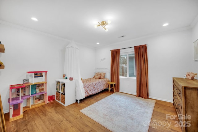 bedroom with recessed lighting, wood finished floors, visible vents, and ornamental molding