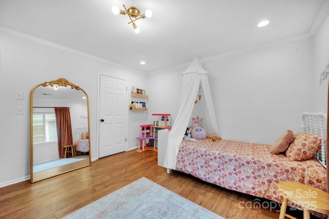 bedroom with recessed lighting, crown molding, baseboards, and wood finished floors