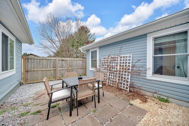 view of patio / terrace with outdoor dining area and fence