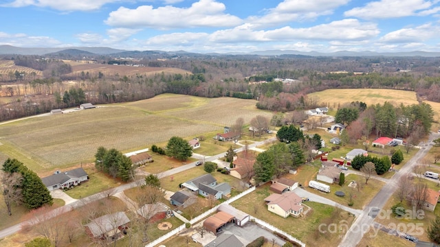 bird's eye view featuring a mountain view and a rural view