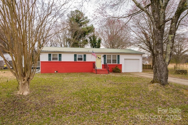 ranch-style home featuring concrete driveway, a front yard, an attached garage, metal roof, and brick siding