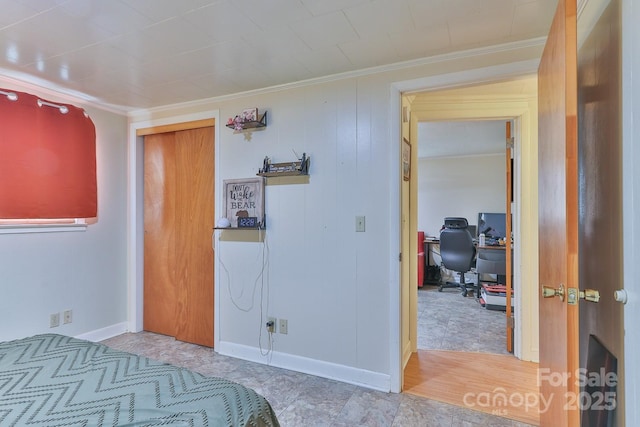 bedroom featuring baseboards and ornamental molding