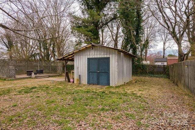 view of shed featuring a fenced backyard