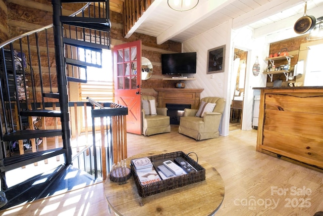 151 Pinewood Dr, Murphy, NC 28906 - living area with wooden walls, wood finished floors, a fireplace, wooden ceiling, and beamed ceiling