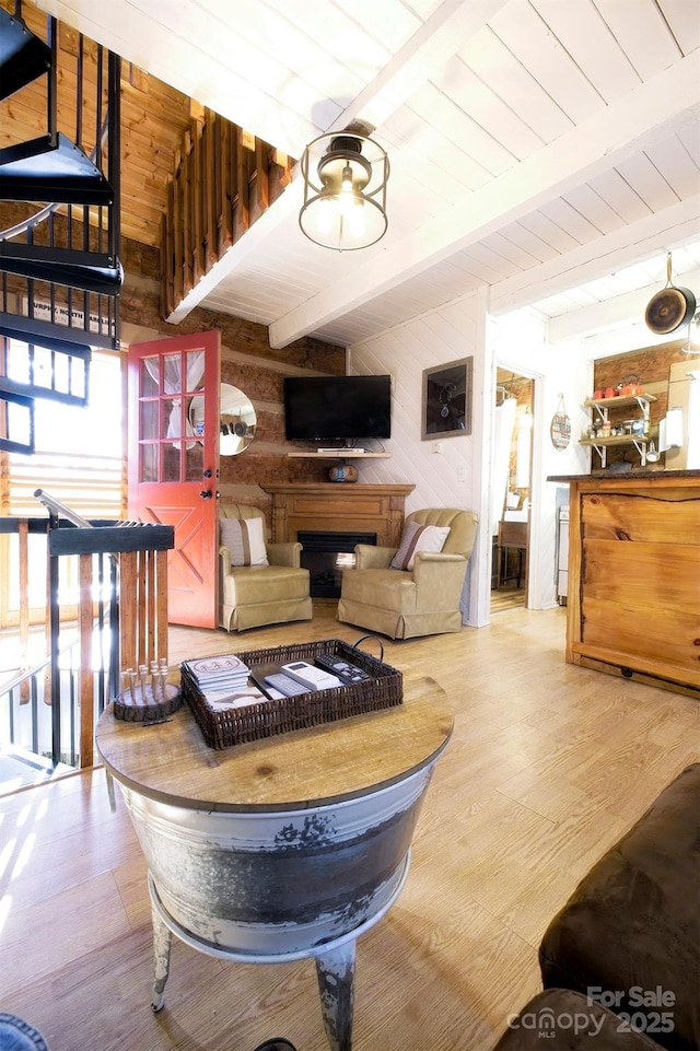 151 Pinewood Dr, Murphy, NC 28906 - living room with wooden walls, wood finished floors, beam ceiling, a fireplace, and wood ceiling