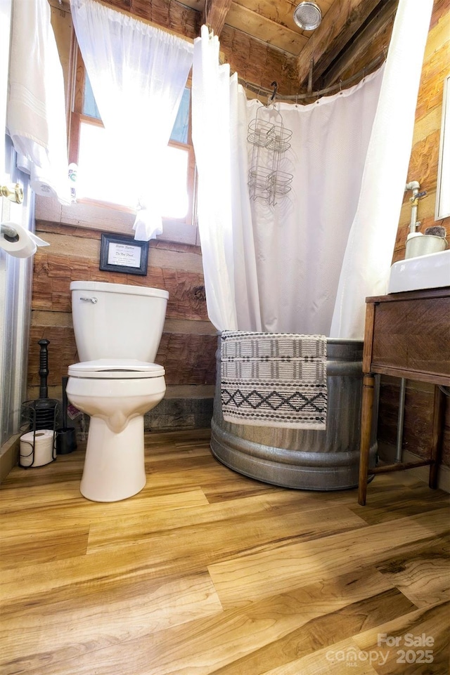 151 Pinewood Dr, Murphy, NC 28906 - bathroom with curtained shower, toilet, and wood finished floors