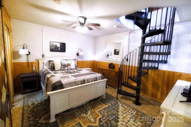 151 Pinewood Dr, Murphy, NC 28906 - bedroom with ceiling fan, dark tile patterned flooring, wooden walls, and wainscoting