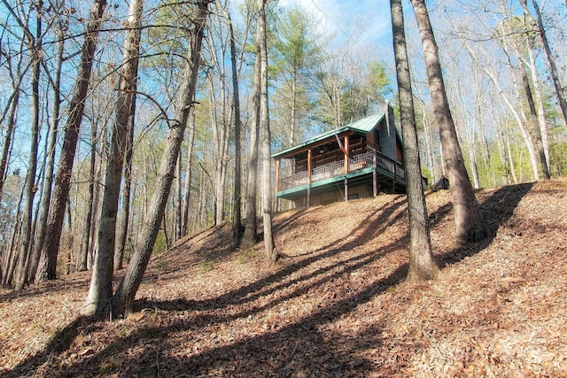 151 Pinewood Dr, Murphy, NC 28906 - view of front of house with a wooden deck, metal roof, and a view of trees