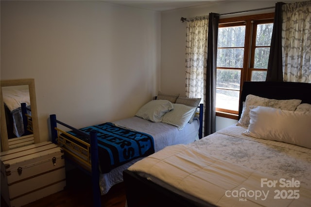 bedroom featuring multiple windows