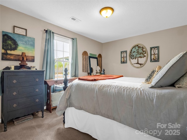 bedroom with carpet flooring and visible vents