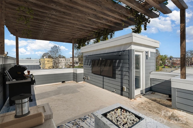 view of patio / terrace with a fire pit