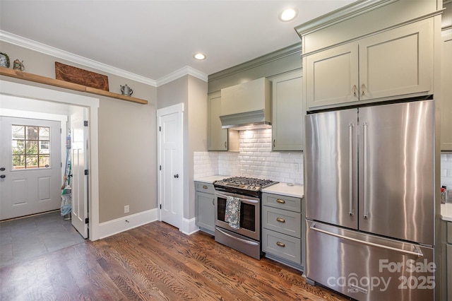 kitchen featuring gray cabinetry, ornamental molding, backsplash, stainless steel appliances, and light countertops