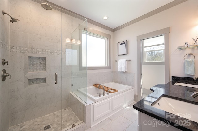 full bathroom featuring crown molding, plenty of natural light, a garden tub, and a stall shower